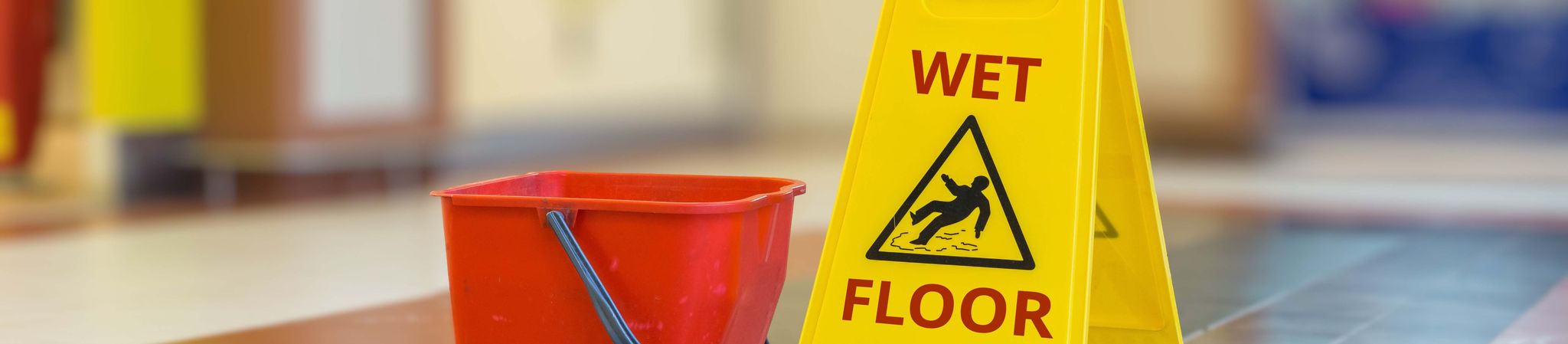Mop bucket and wet floor sign
